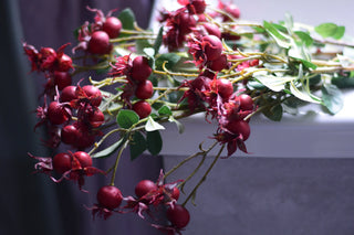 Faux rosehip spray in red color