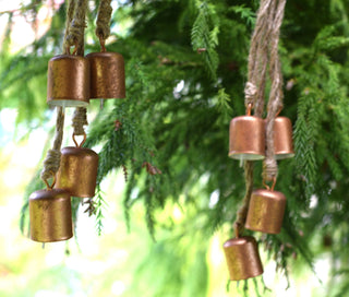 Set of four  small bronze bells