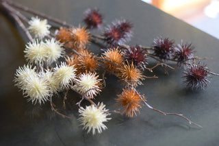 Faux burdock seeds spray in white,yellow and purple colours