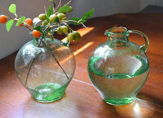 Round glass jug in green tone