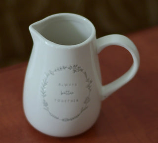 Ceramic jug with text "Always Better Together"